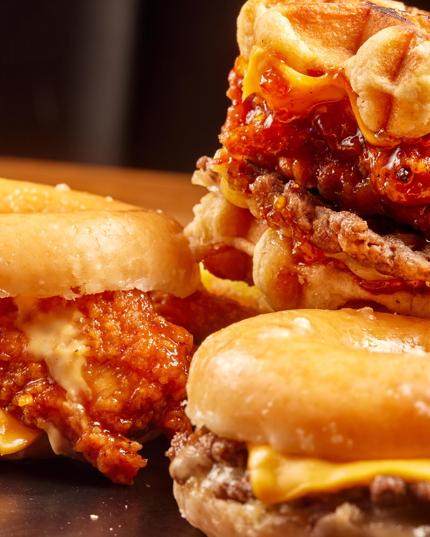 Sticky glazed chicken in a waffle burger, between two doughnut-bun burgers