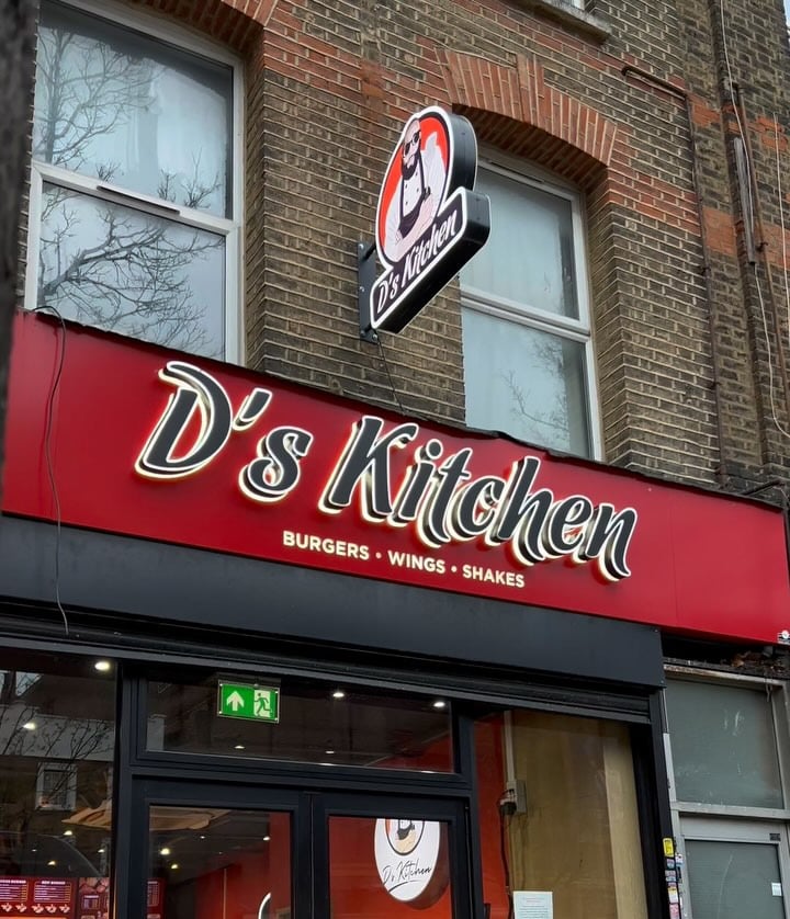The red D’s Kitchen sign above the shop door
