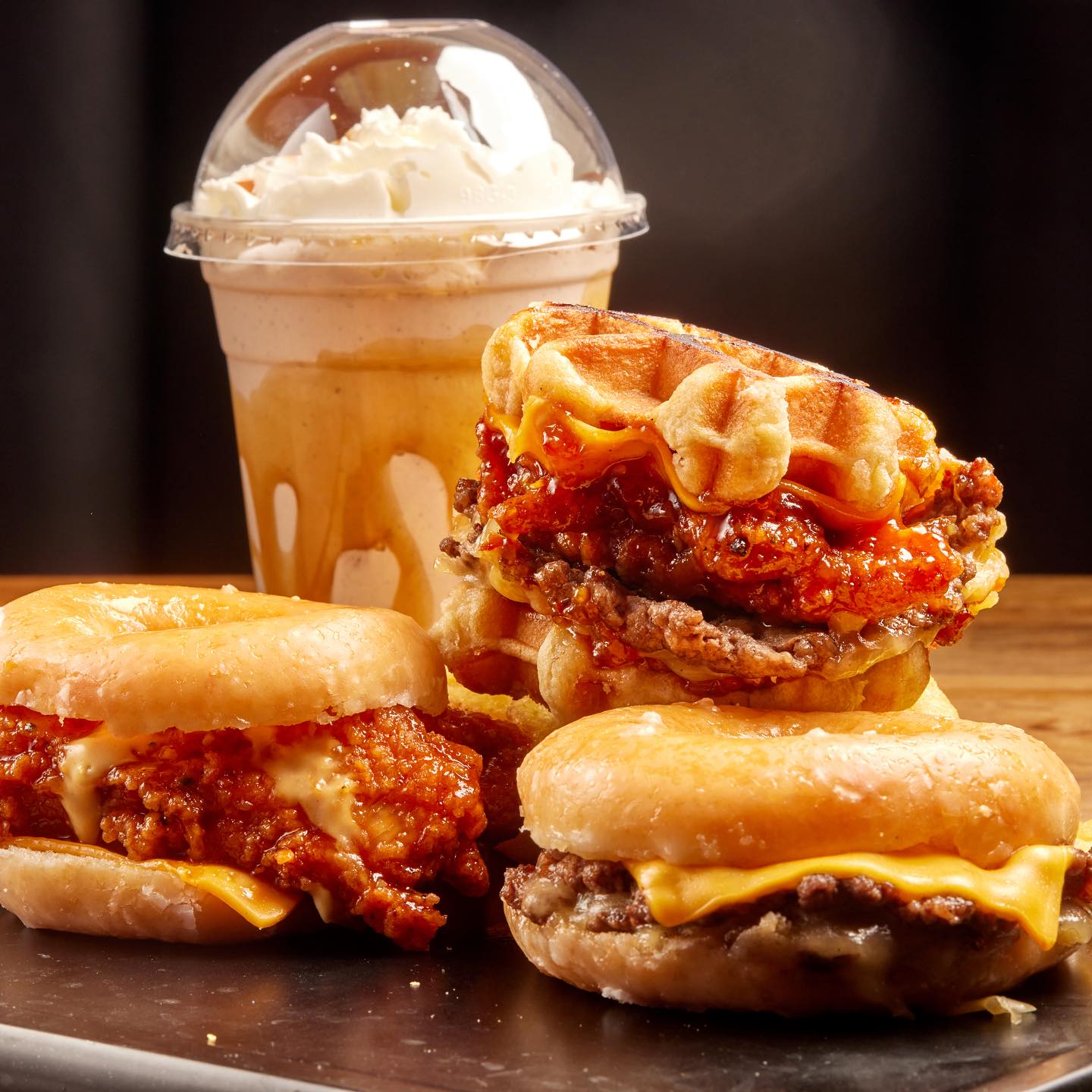 Waffle burger, two doughnut-bun burgers and a milkshake